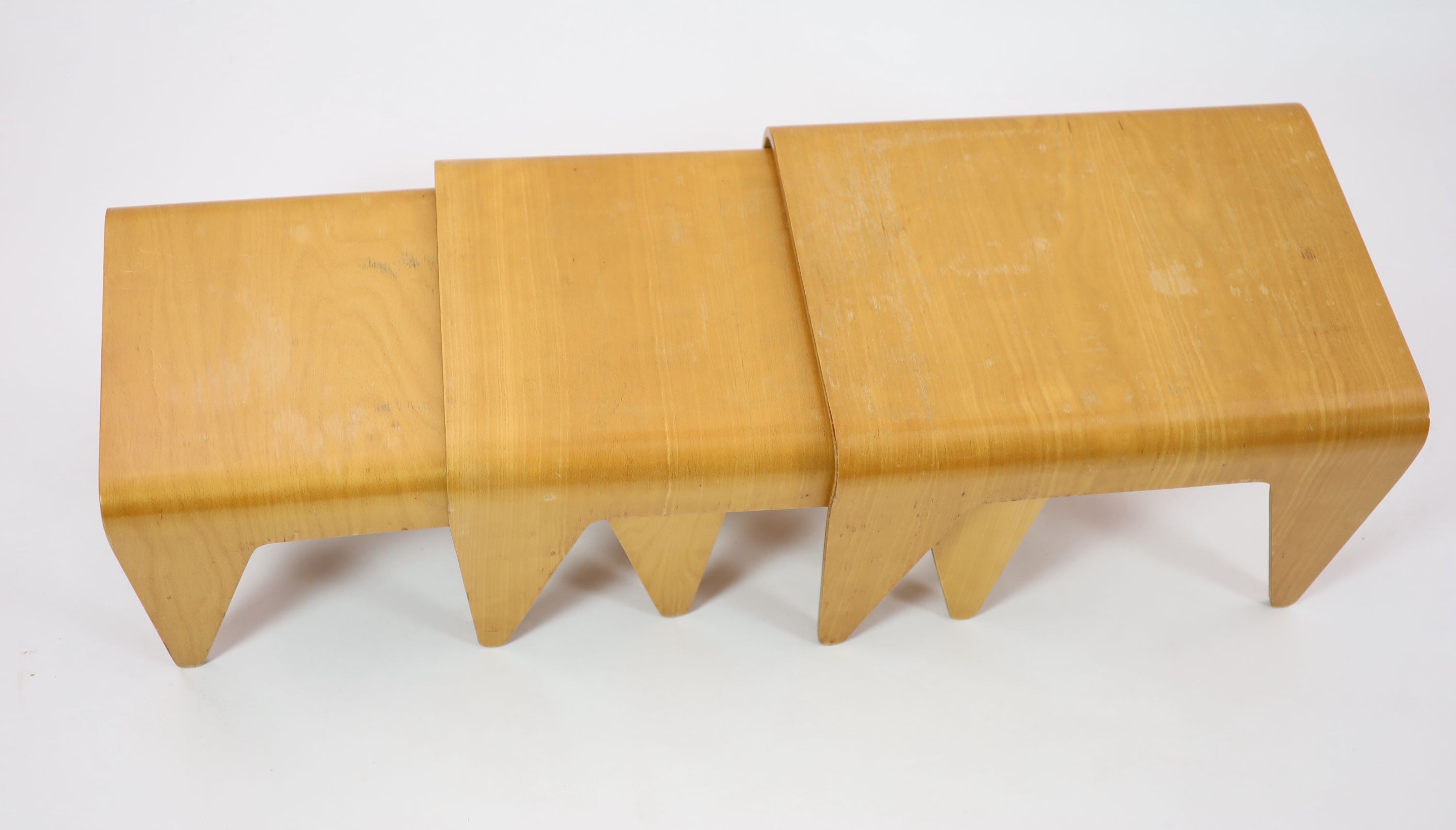 Marcel Breuer (Hungarian 1901-1981) probably by Isokon, a nest of three bent ply birch laminate tables, W.61cm. D.46cm. H.38cm.